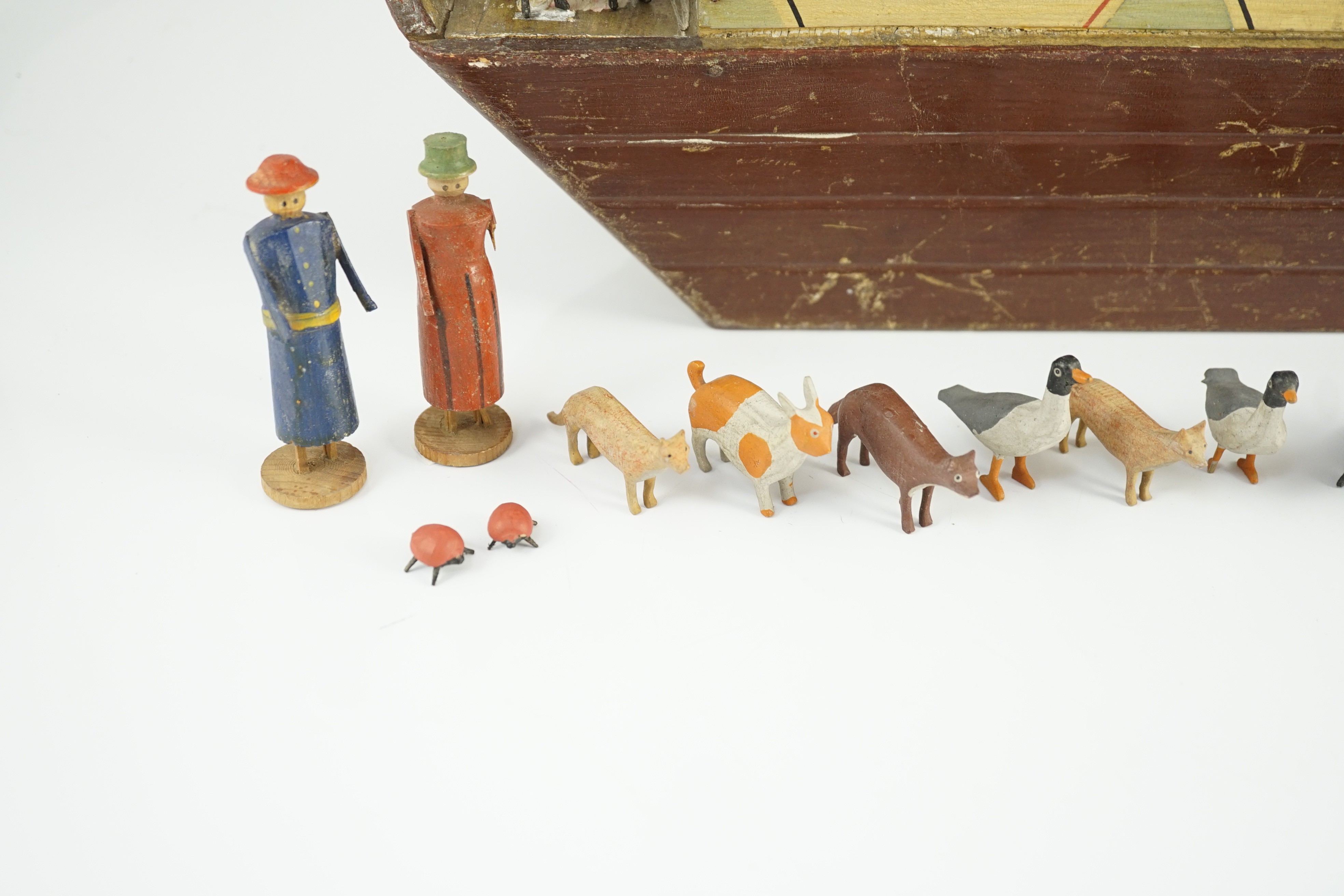 A late 19th century German painted wood Noah's Ark with 136 assorted figures and animals, 14cm wide, 54cm long, 30cm high, largest figure 8cm